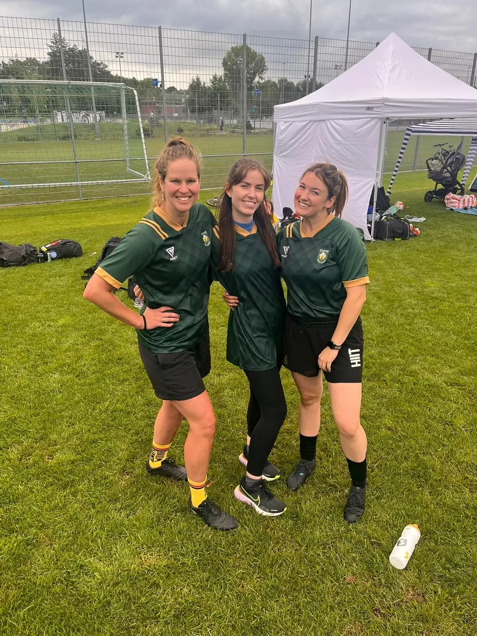 Women and men playing side by side in a mixed touch rugby team